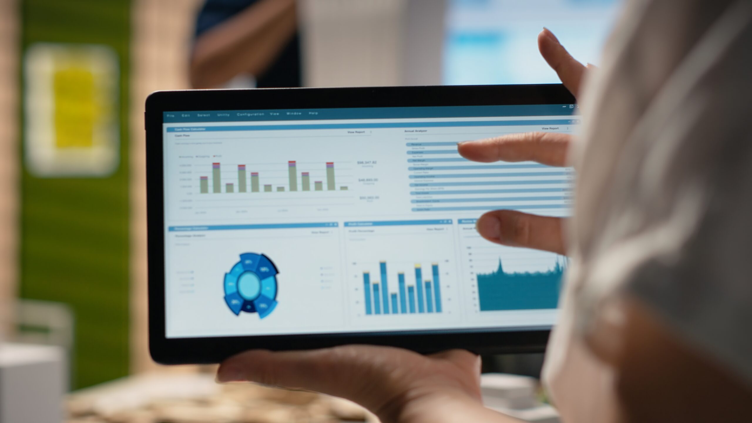 Digital marketing specialist analyzing web analytics data on laptop.